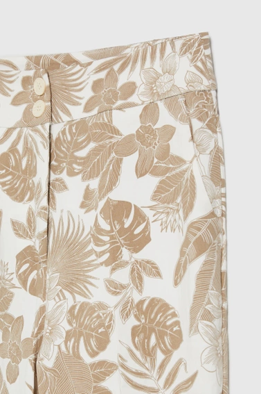 Spodnie z roślinnym wzorem beżowe