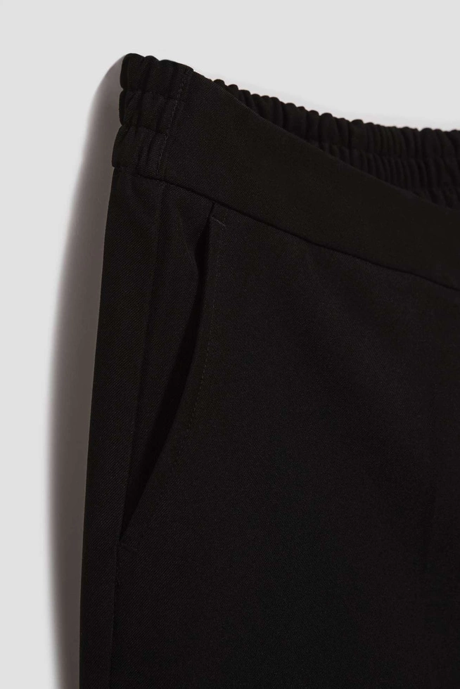 Gładkie spodnie z szerokimi nogawkami