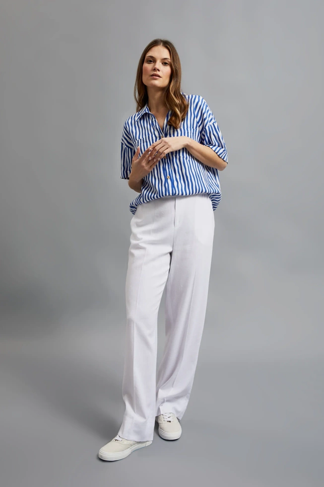 Lniane spodnie z nogawkami w kant białe