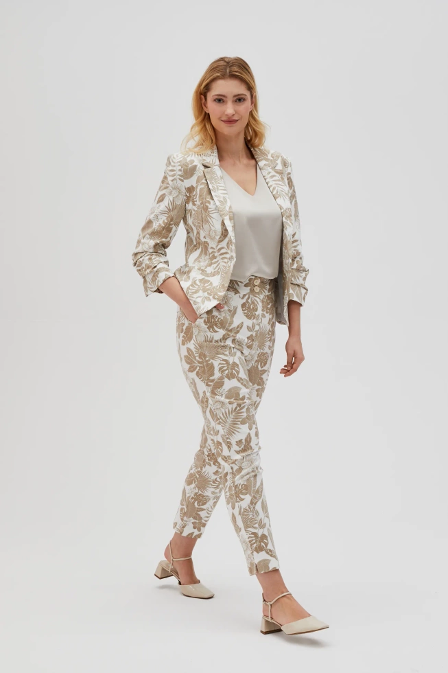 Spodnie z roślinnym wzorem beżowe