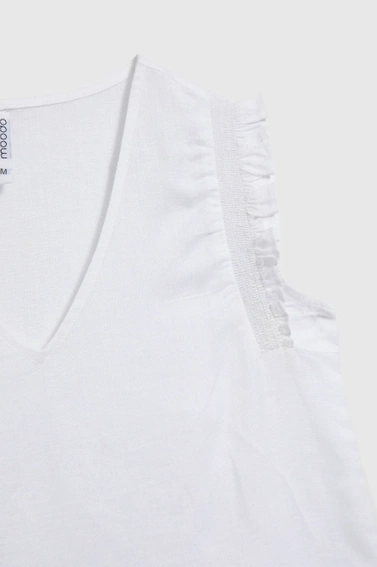 Koszula z falbaną na ramionach biała