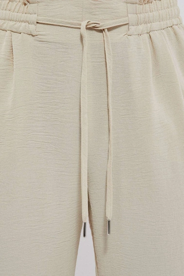 Gładkie spodnie z wiązaniem piaskowe