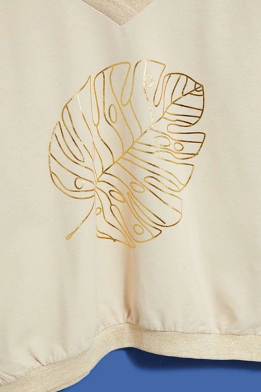 Bluza z dekoltem w serek i nadrukiem piaskowa