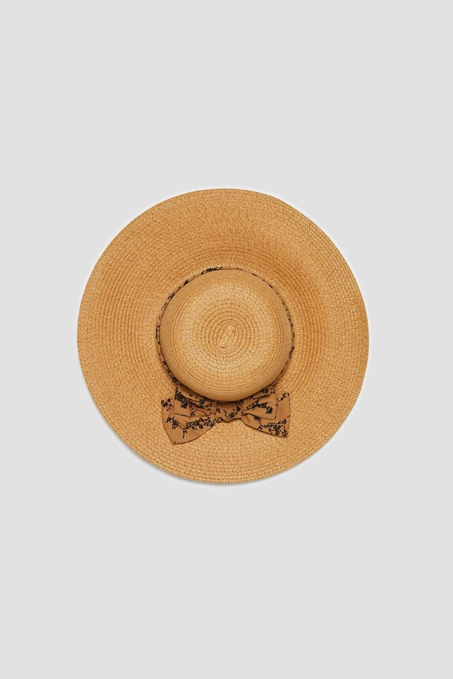 Kapelusz słomkowy z szerokim rondem i ozdobną wstążką beżowy