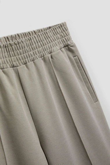 Spodnie w kant z szerokimi nogawkami brązowe