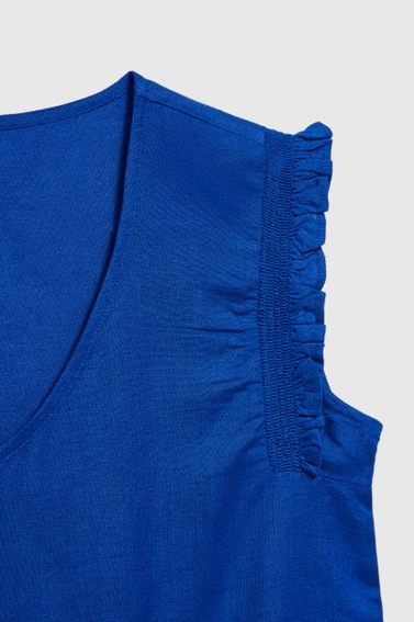 Koszula z falbanką na ramionach niebieska
