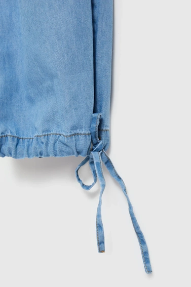 Bawełniane spodnie z wiązaniem na nogawkach niebieskie