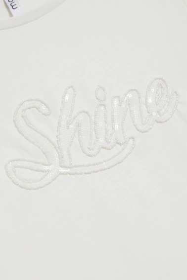 Bluzka z cekinami biała