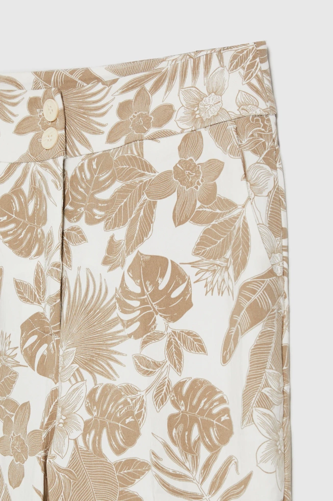 Spodnie z roślinnym wzorem beżowe