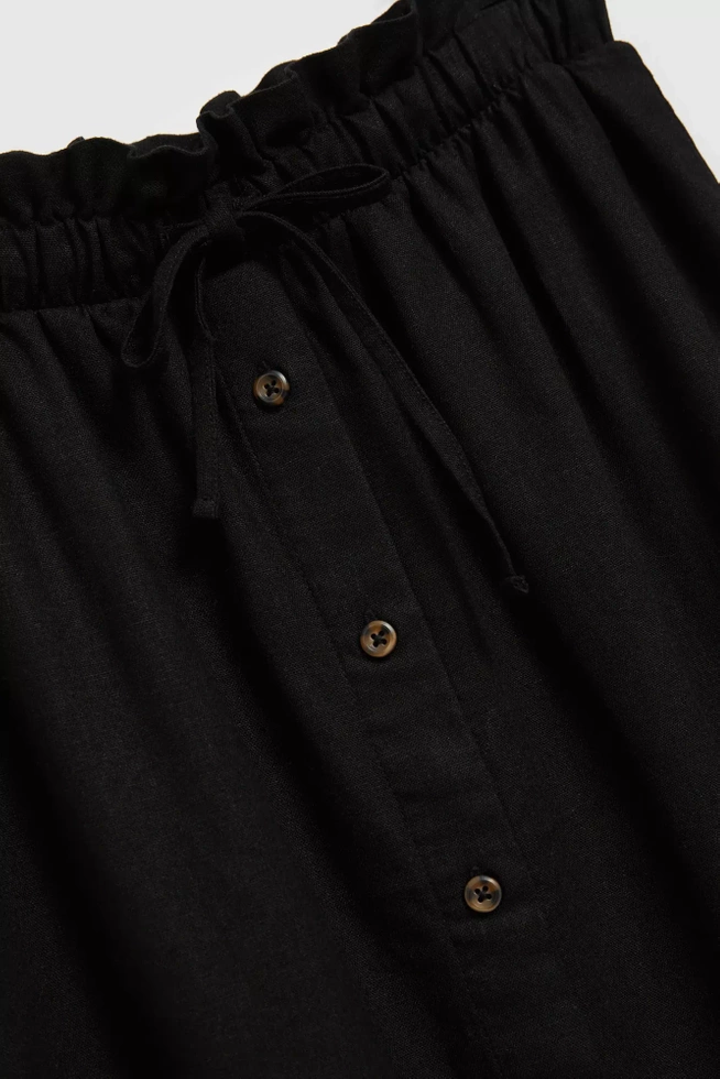 Spódnica zapinana na guziki z gumą w talii czarna