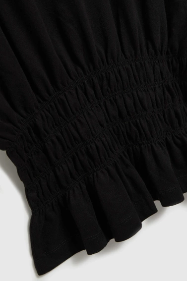 Bluzka z gumą w talii czarna