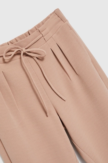 Spodnie z wiązaniem beżowe