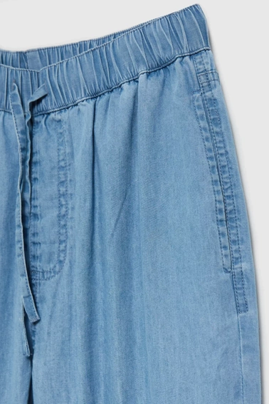 Jeansy z gumą w talii i nogawkach niebieskie